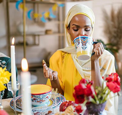 A woman at a Suhoor table