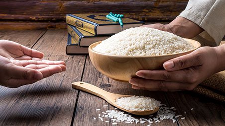 Hands sharing rice